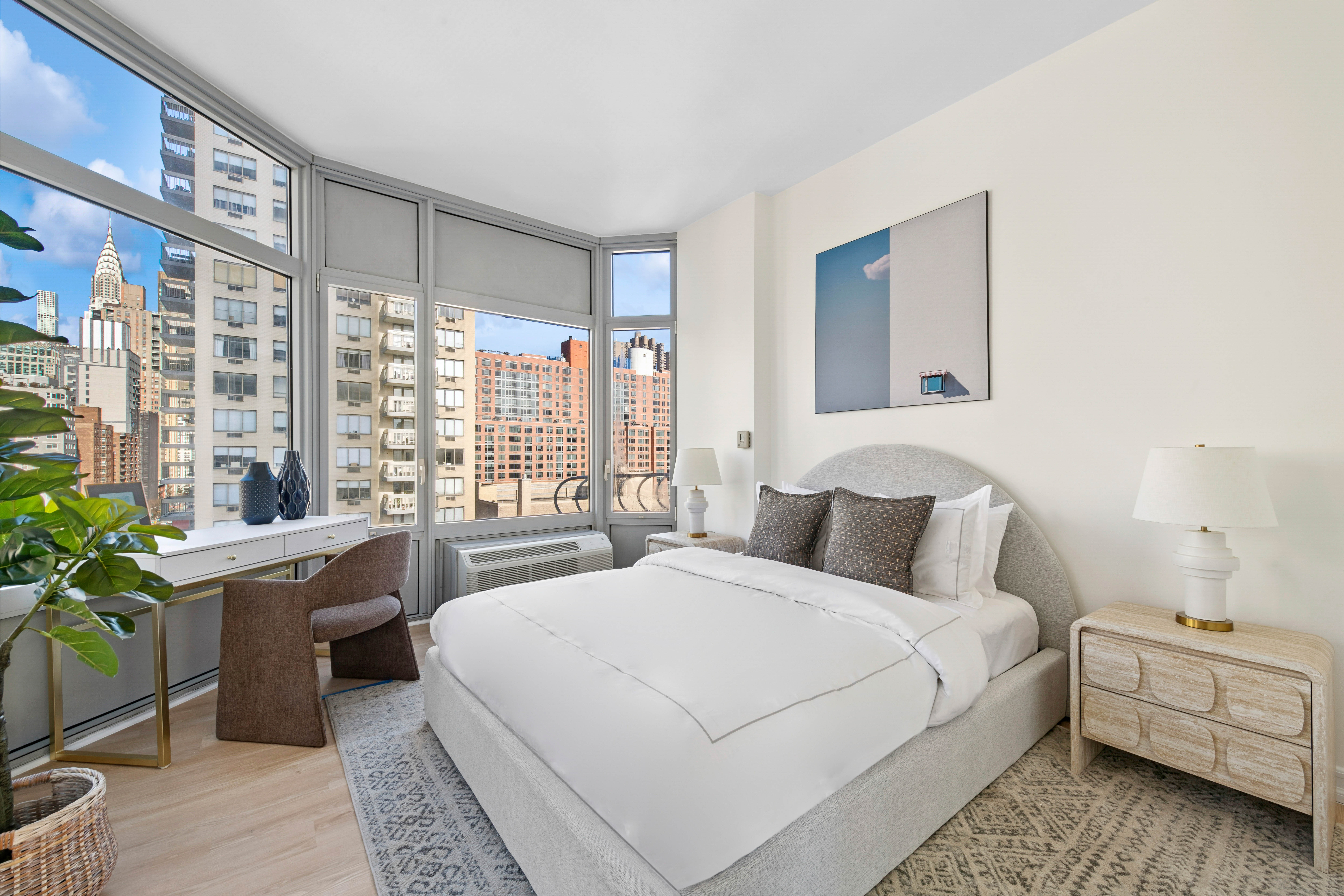 200 East 32nd Street, Unit 11D Manhattan, NY 10016 - Photo 11 of 19 a bedroom with a large bed and a window