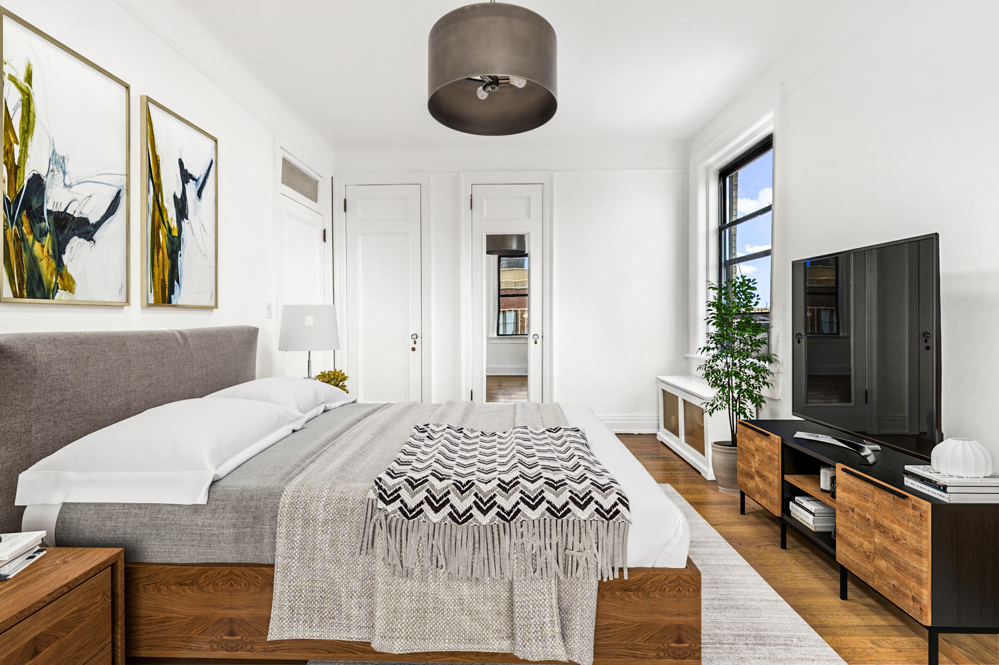 885 West End Avenue, Unit 12D Manhattan, NY 10025 - Photo 12 of 24 a bedroom with a bed a mirror and a flat tv screen on dresser