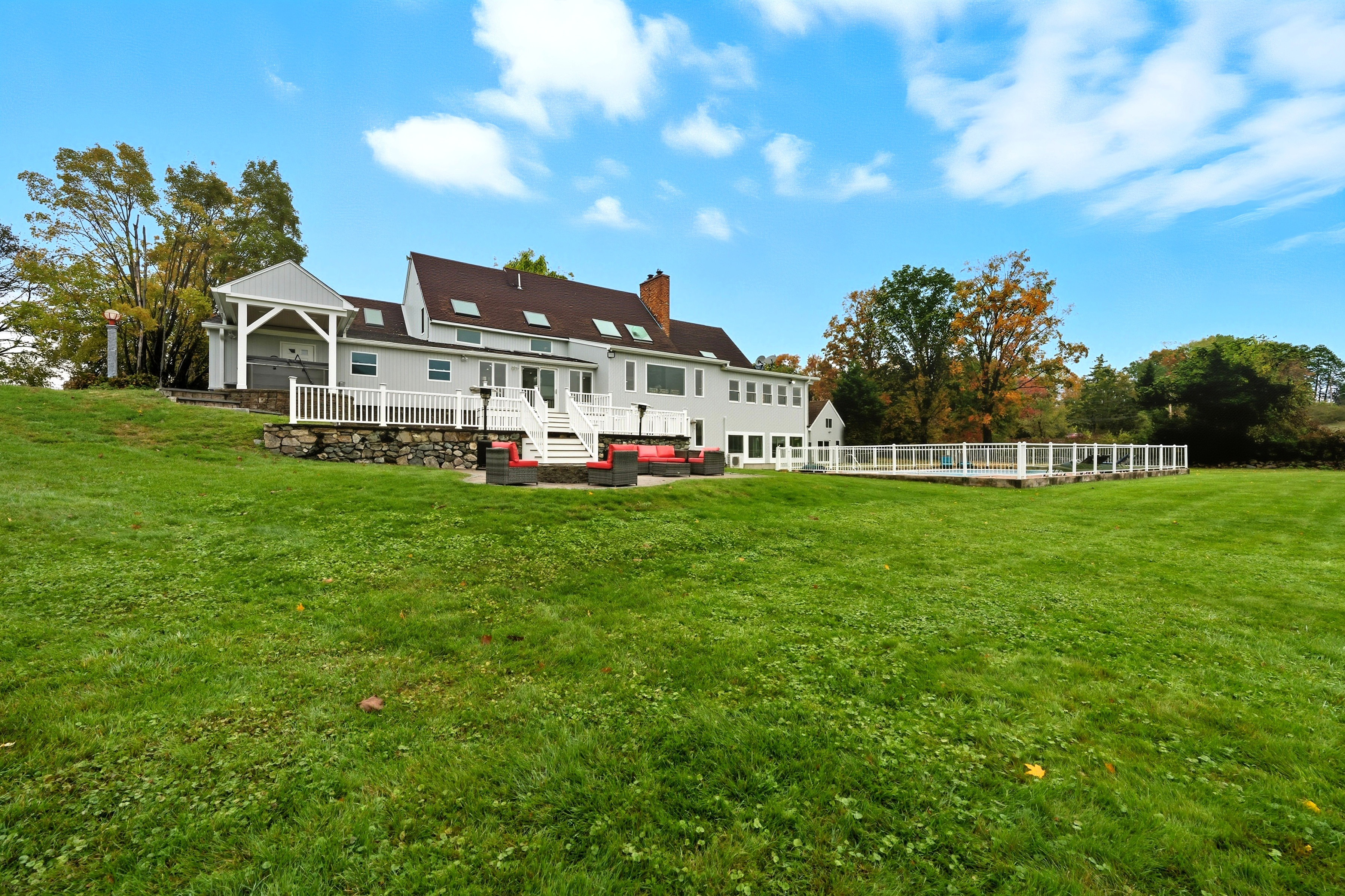 6 Lynbrook Road Southborough, MA 01772 - Photo 68 of 84 a front view of a house with a yard table and chairs
