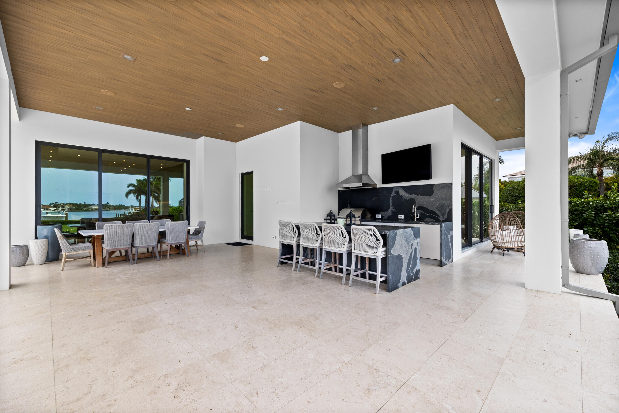 5695 Pennock Point Road Jupiter, FL 33458 - Photo 19 of 77 a living room with furniture and a flat screen tv
