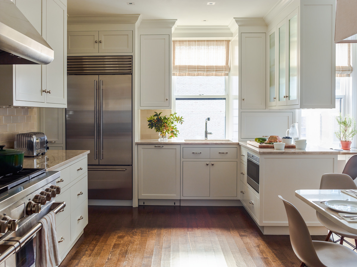 325 West End Avenue, Unit 9C Manhattan, NY 10023 - Photo 6 of 14 a kitchen with a refrigerator and a sink