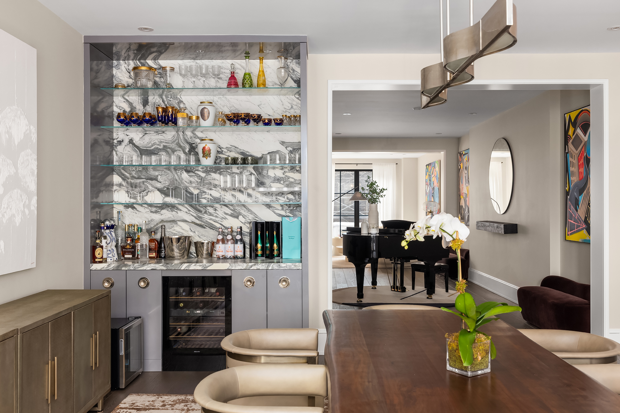 123 East 61st Street Manhattan, NY 10065 - Photo 8 of 31 a living room filled with furniture and a chandelier