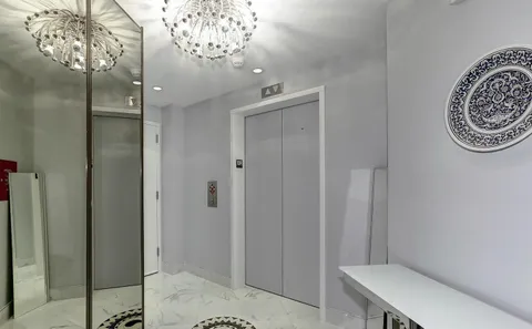 a bathroom with a mirror and a shower