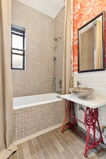 a bathroom with a sink and a bathtub