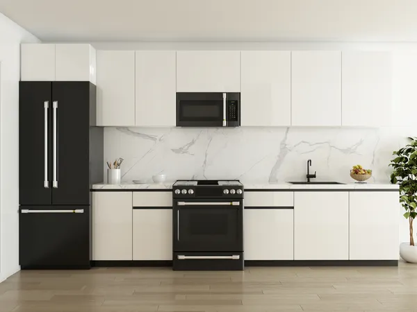 a kitchen with stainless steel appliances granite countertop white cabinets a microwave a sink and a refrigerator