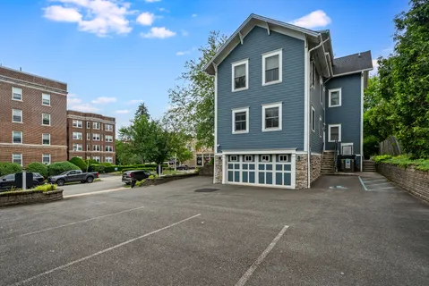 a view of a house with a yard and plants