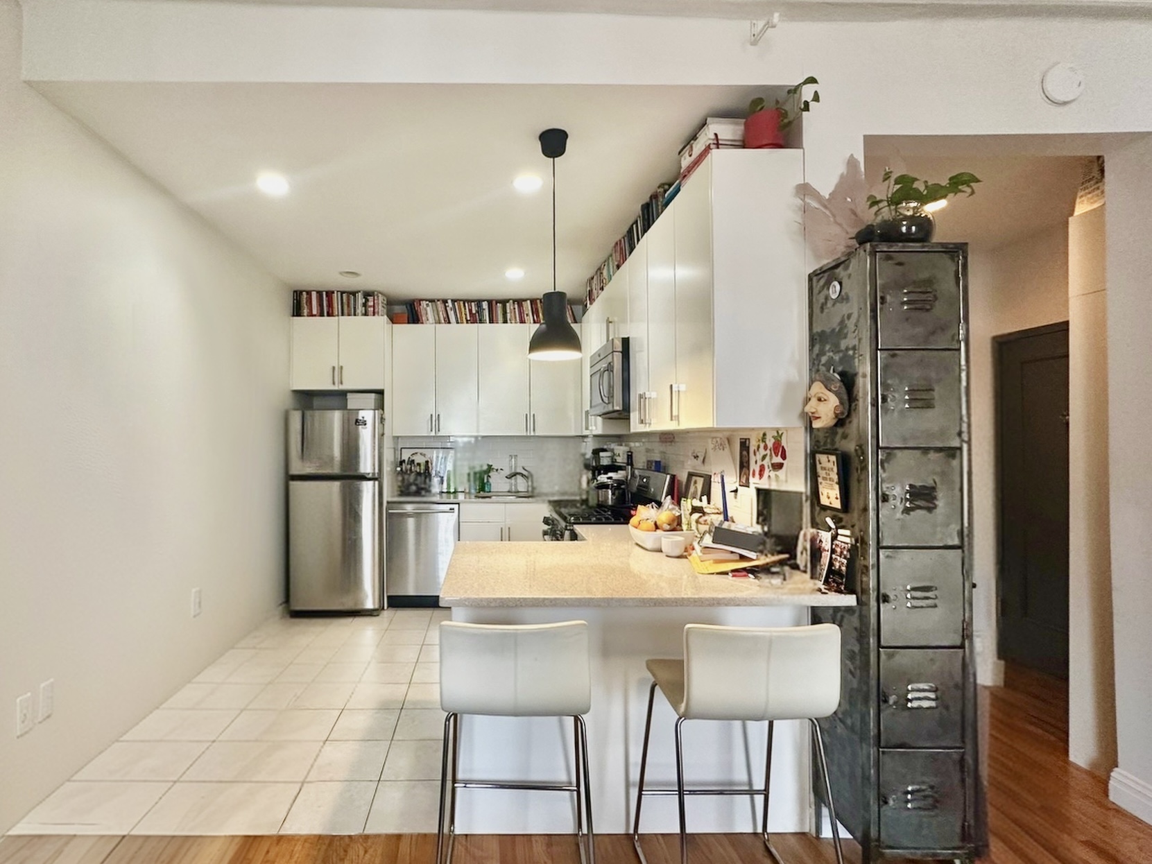 89 Wyckoff Street, Unit 3B Brooklyn, NY 11201 - Photo 2 of 8 a kitchen with a table and chairs