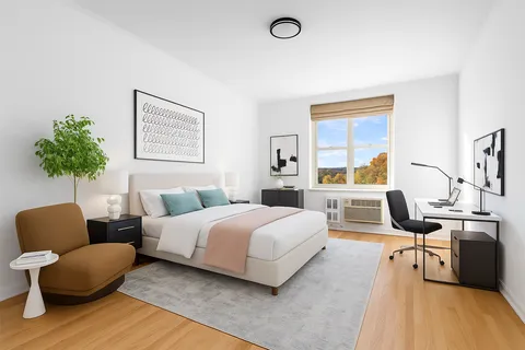 a bedroom with a bed and a couch