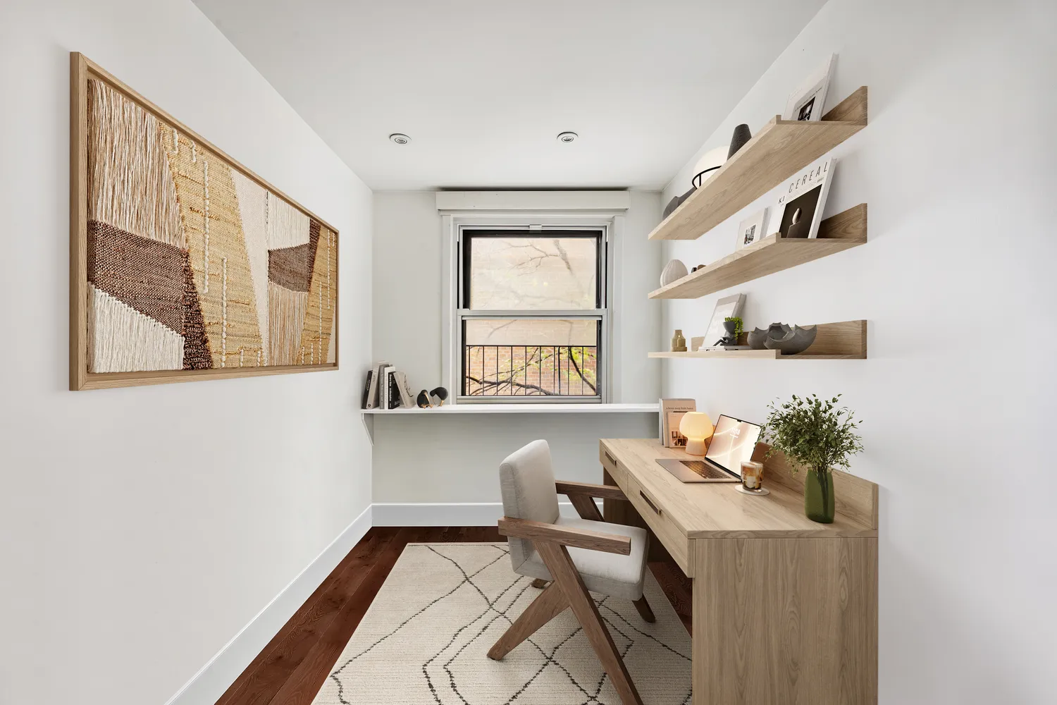 a workspace with furniture and window