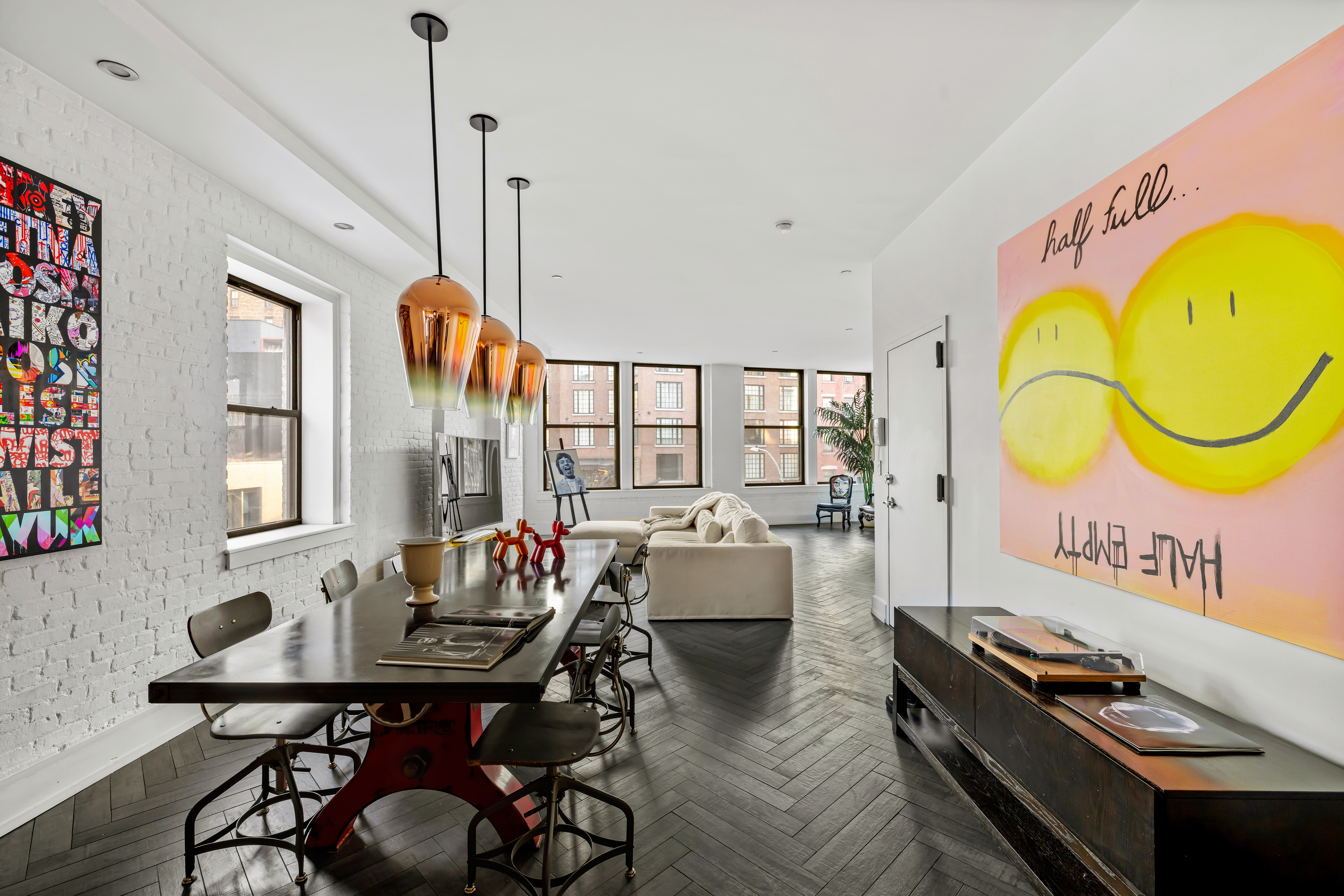 a living room with furniture a table and a chandelier