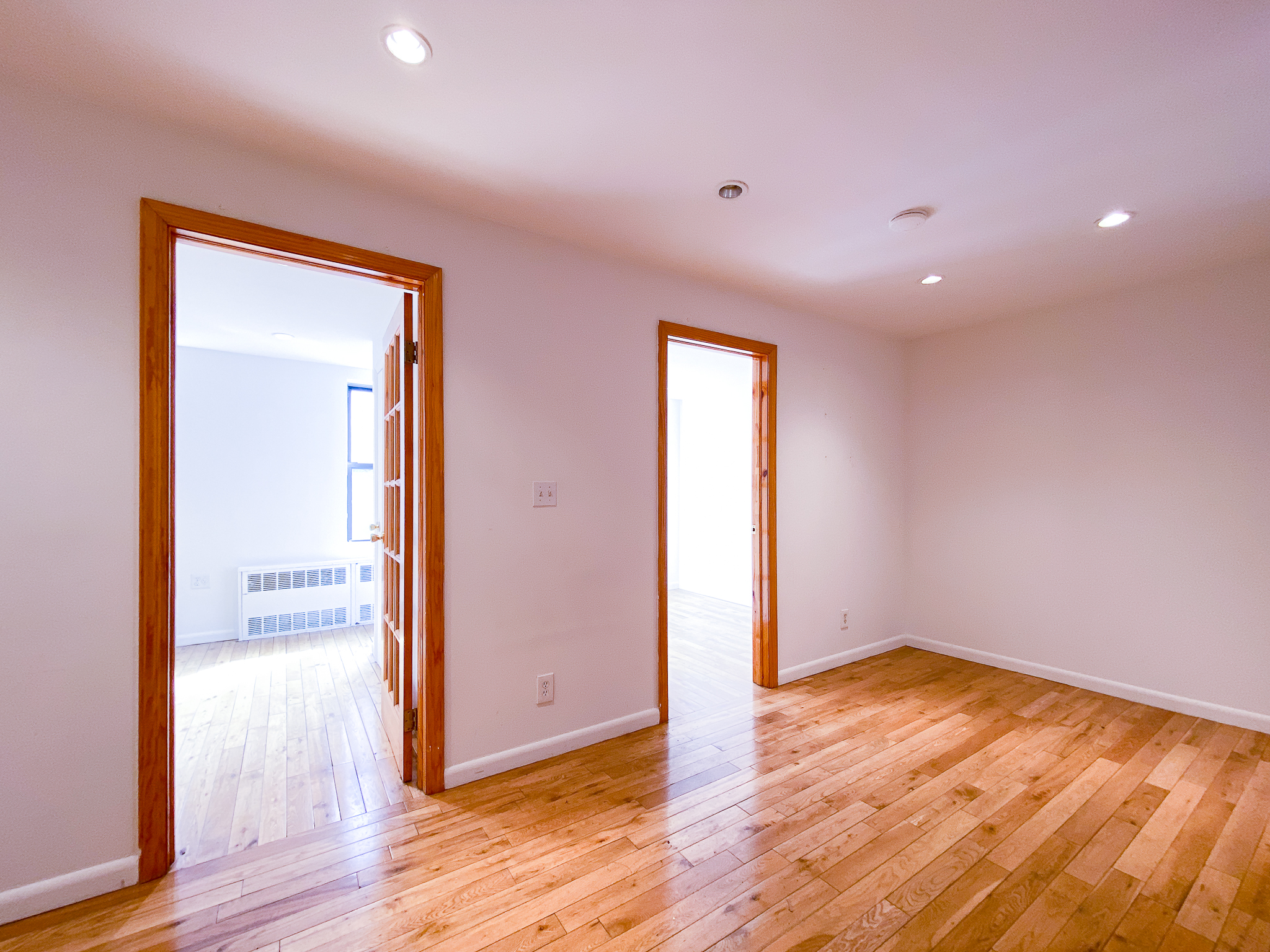 157 East 3rd Street, Unit 2B Manhattan, NY 10009 - Photo 7 of 18 a view of empty room with wooden floor