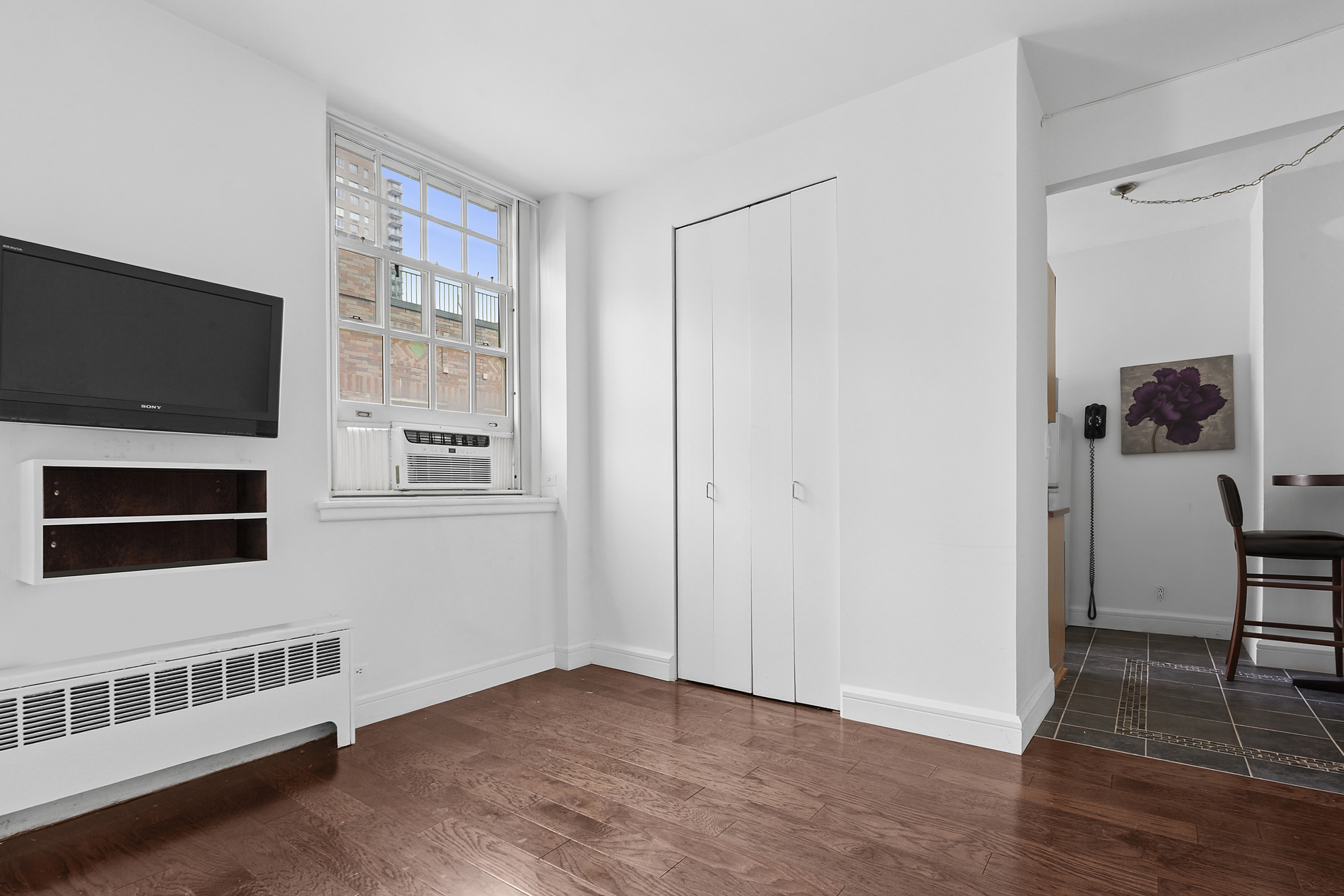 509 East 77th Street, Unit 6G Manhattan, NY 10075 - Photo 2 of 10 a view of livingroom with furniture and workspace