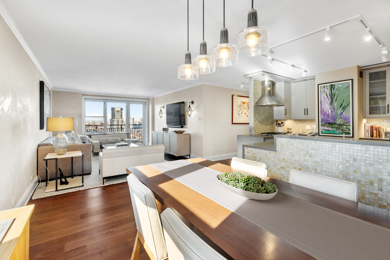 201 West 70th Street, Unit 29KL Manhattan, NY 10023 - Photo 1 of 20 a living room with kitchen island furniture and a chandelier