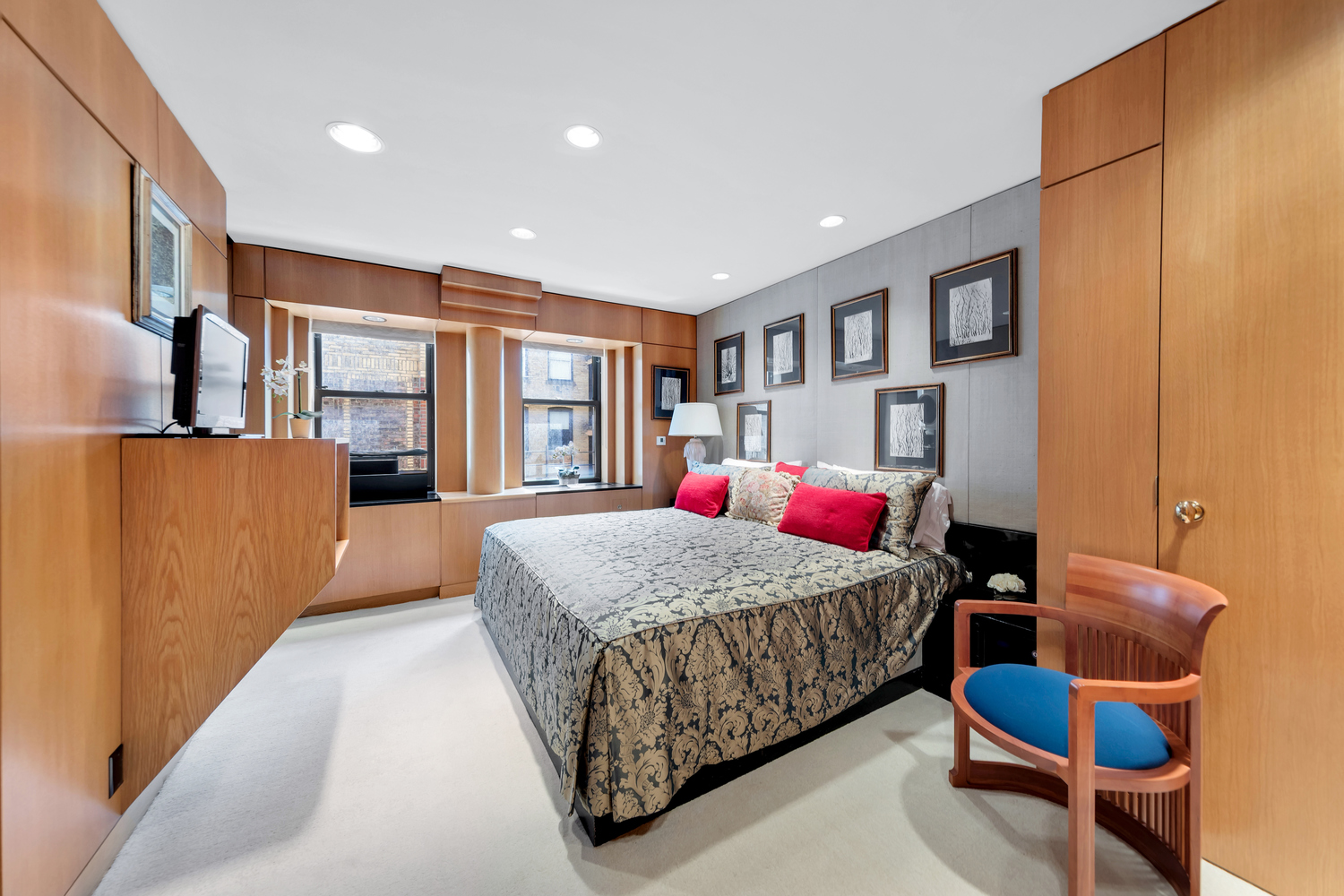 50 East 77th Street, Unit 8C Manhattan, NY 10075 - Photo 12 of 14 a bedroom with a large bed and a dresser