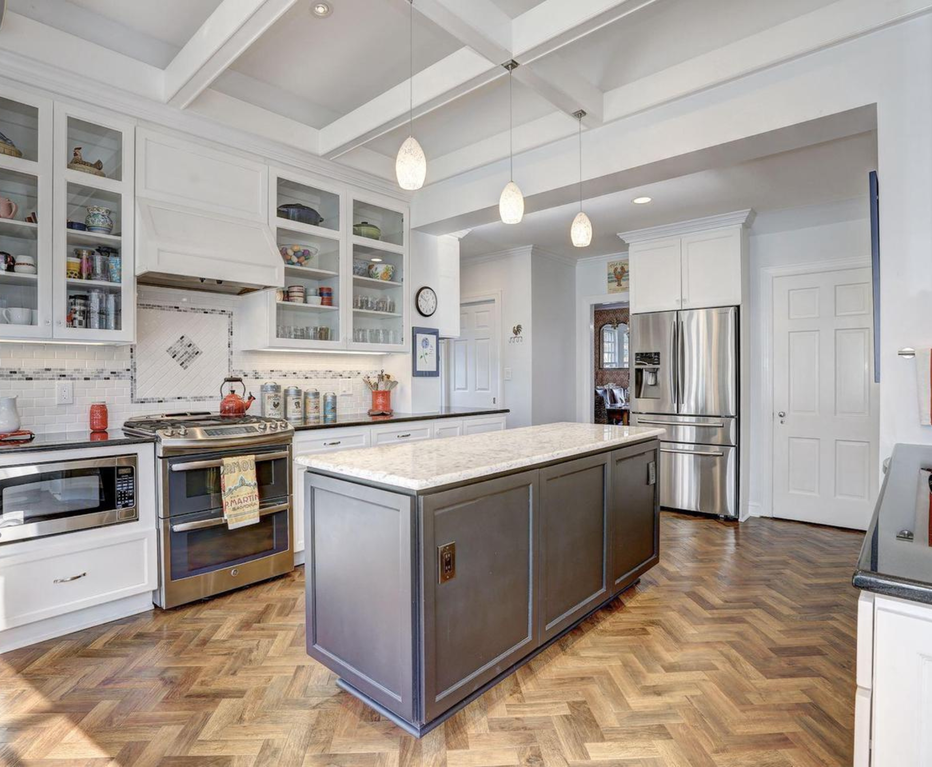 5002 Allan Road Bethesda, MD 20816 - Photo 5 of 9 a kitchen with stainless steel appliances and stove top oven