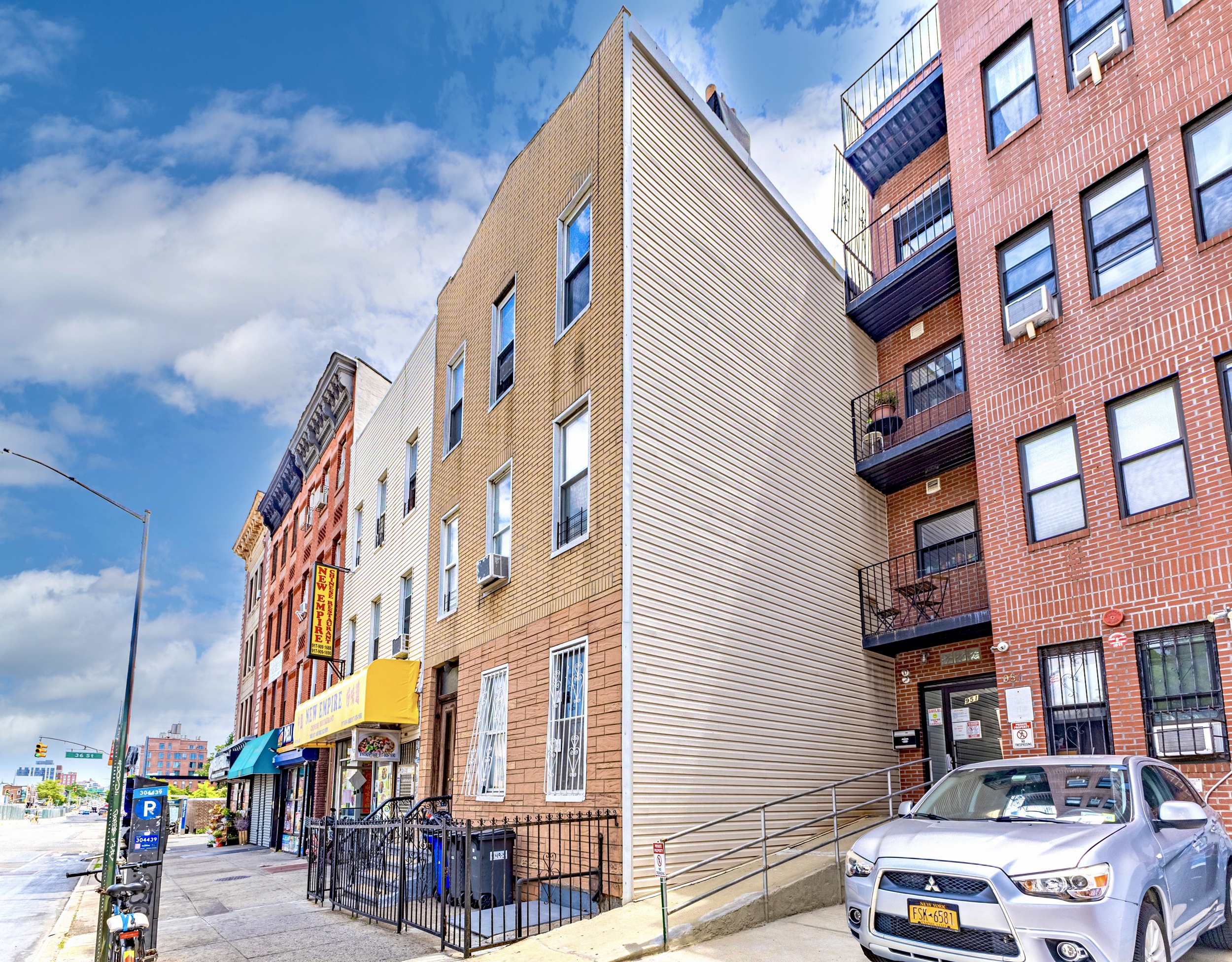 949 4th Avenue Brooklyn, NY 11232 - Photo 2 of 21 a front view of a building with street