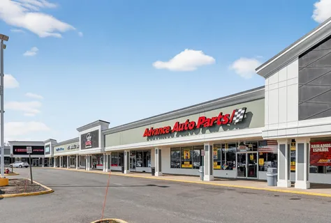 a picture of a bench in front of a wall