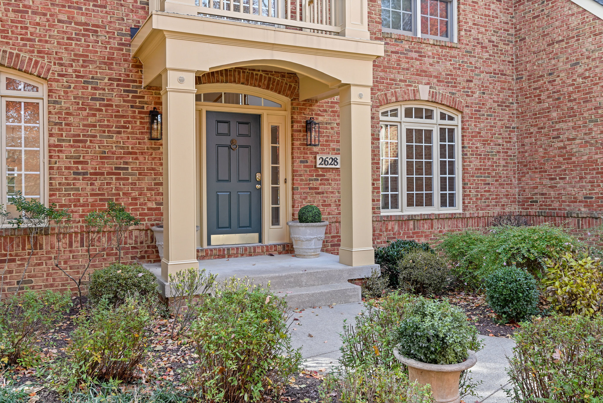2628 Five Oaks Road Vienna, VA 22181 - Photo 3 of 40 a front view of a house with garden