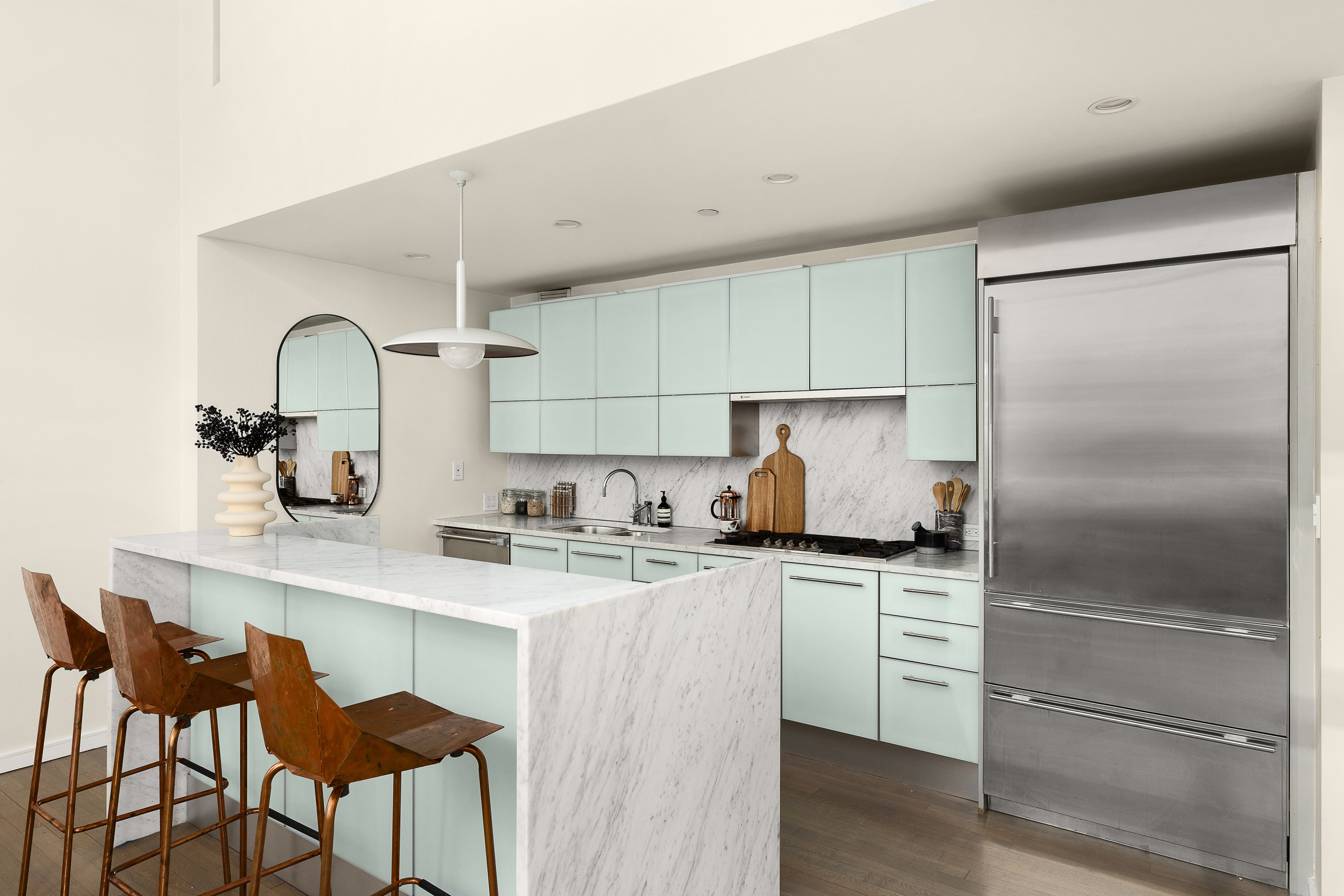 310 East 53rd Street, Unit 2/3D Manhattan, NY 10022 - Photo 6 of 13 a kitchen with stainless steel appliances granite countertop a sink stove and refrigerator