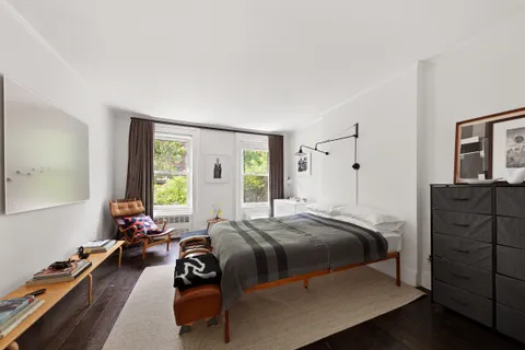 a bed room with a bed and a couch