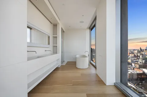 a bathroom with a bathtub and shower