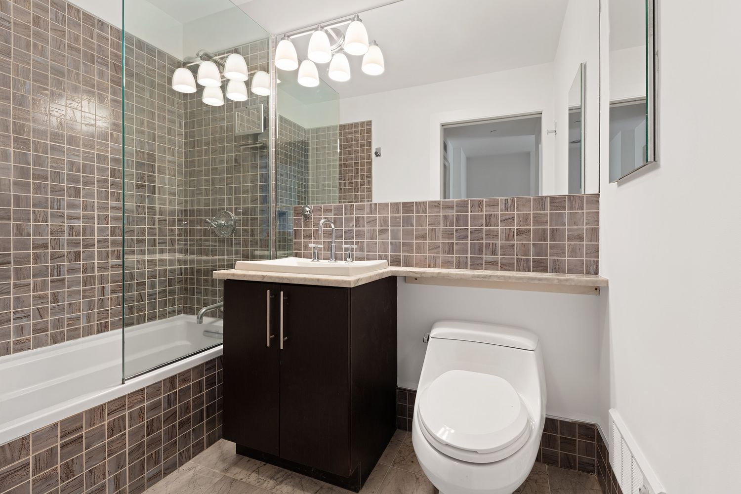 221 West 148th Street, Unit 4B Manhattan, NY 10039 - Photo 4 of 10 a bathroom with a sink a toilet and bathtub