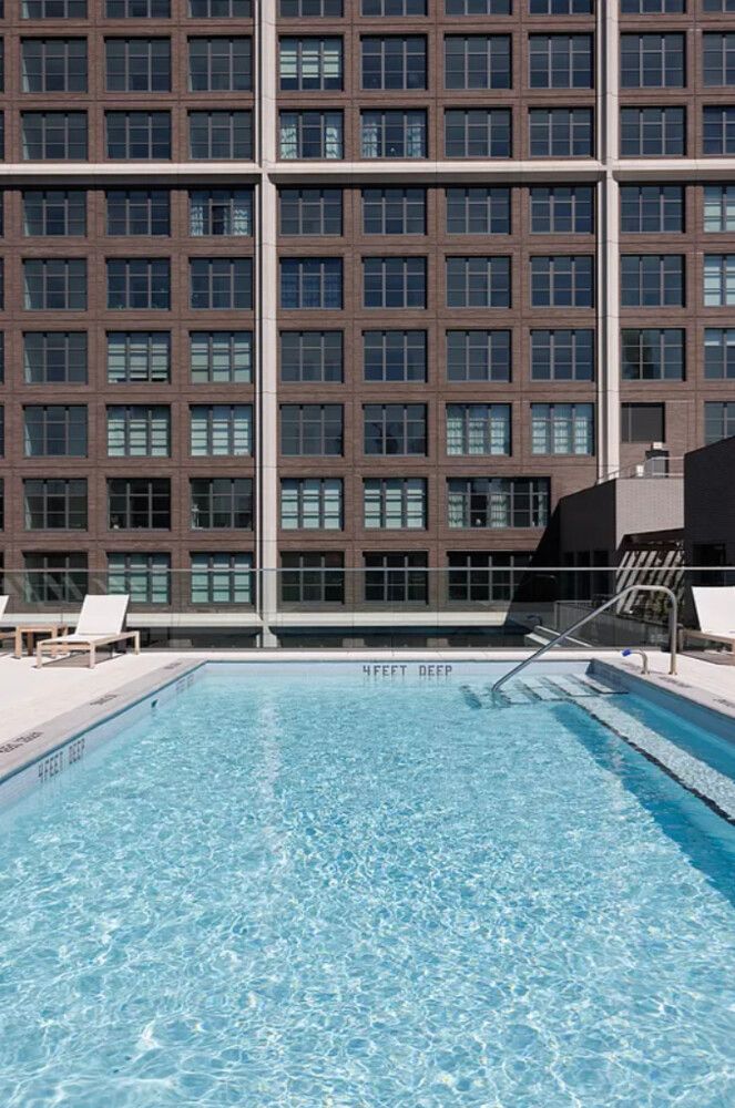 115 York Street, Unit PH20B Brooklyn, NY 11201 - Photo 11 of 21 a view of a large building with a swimming pool