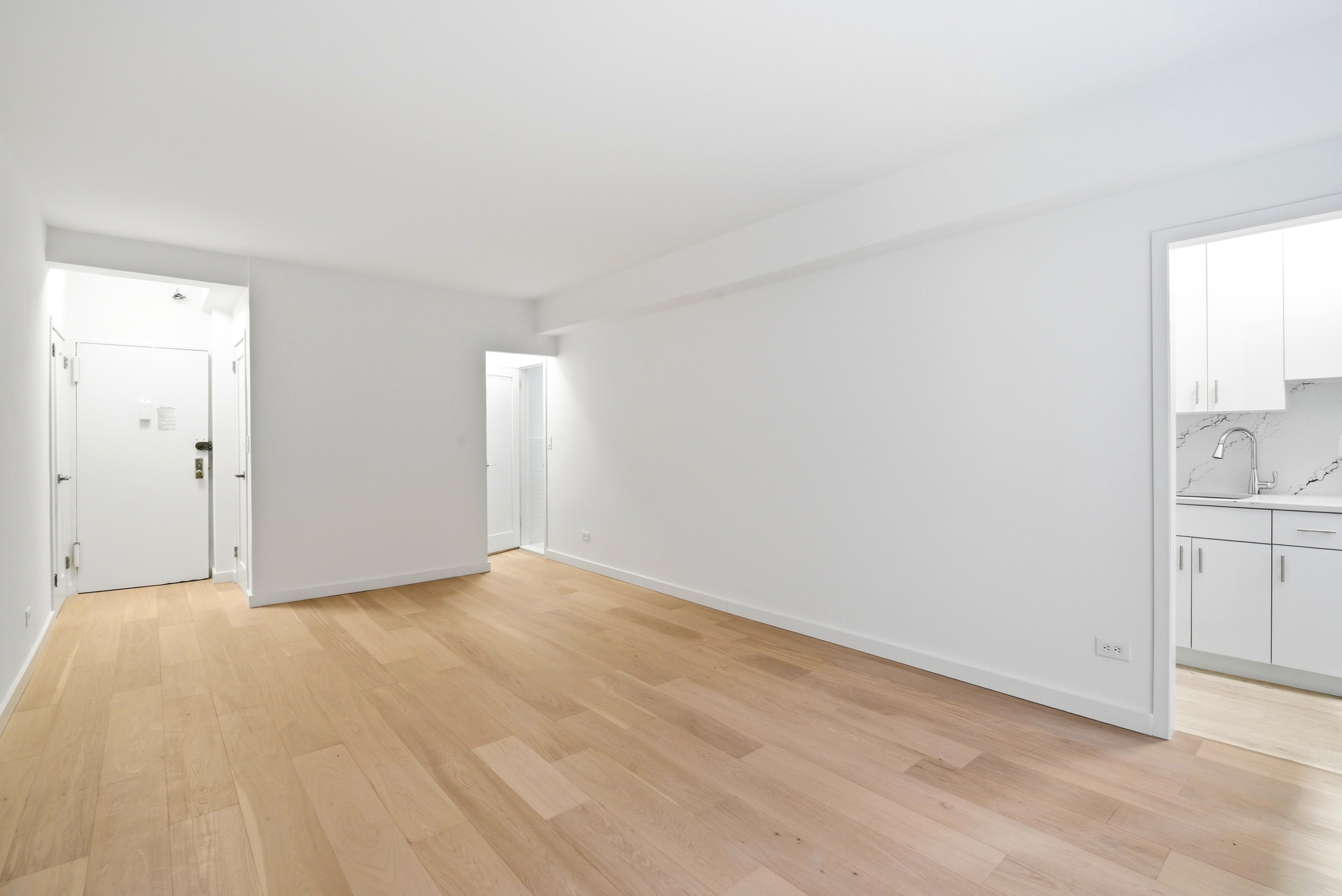 240 East 46th Street, Unit 8J Manhattan, NY 10017 - Photo 3 of 11 a view of an empty room and window