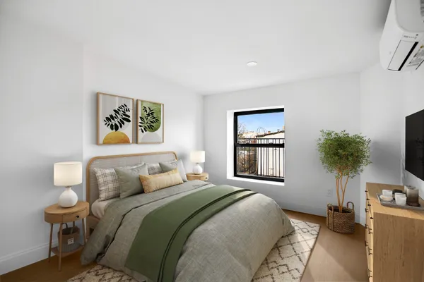 a bedroom with a bed and a chair