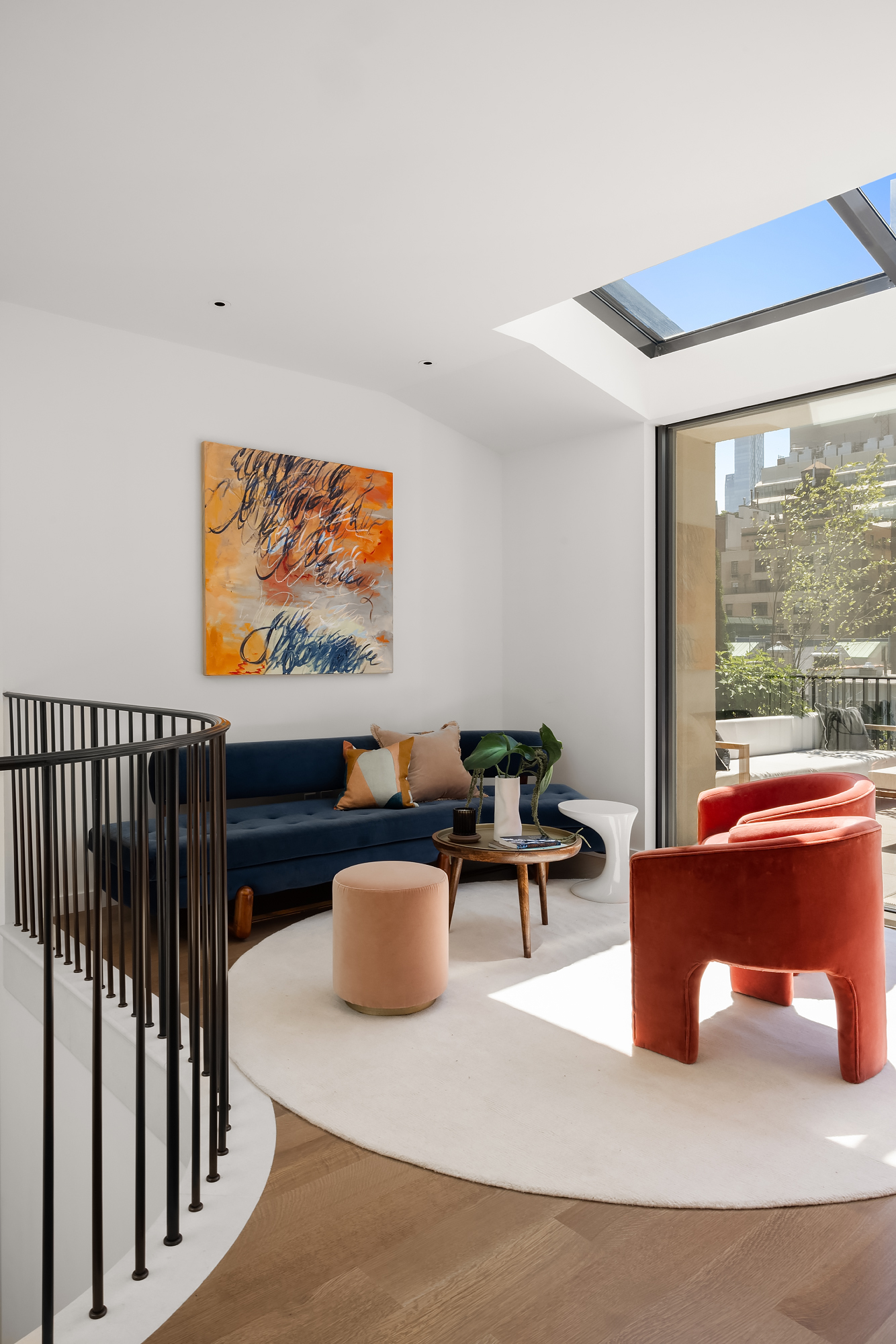 48-50 West 69th Street Manhattan, NY 10023 - Photo 21 of 33 a living room with furniture a rug and a large window