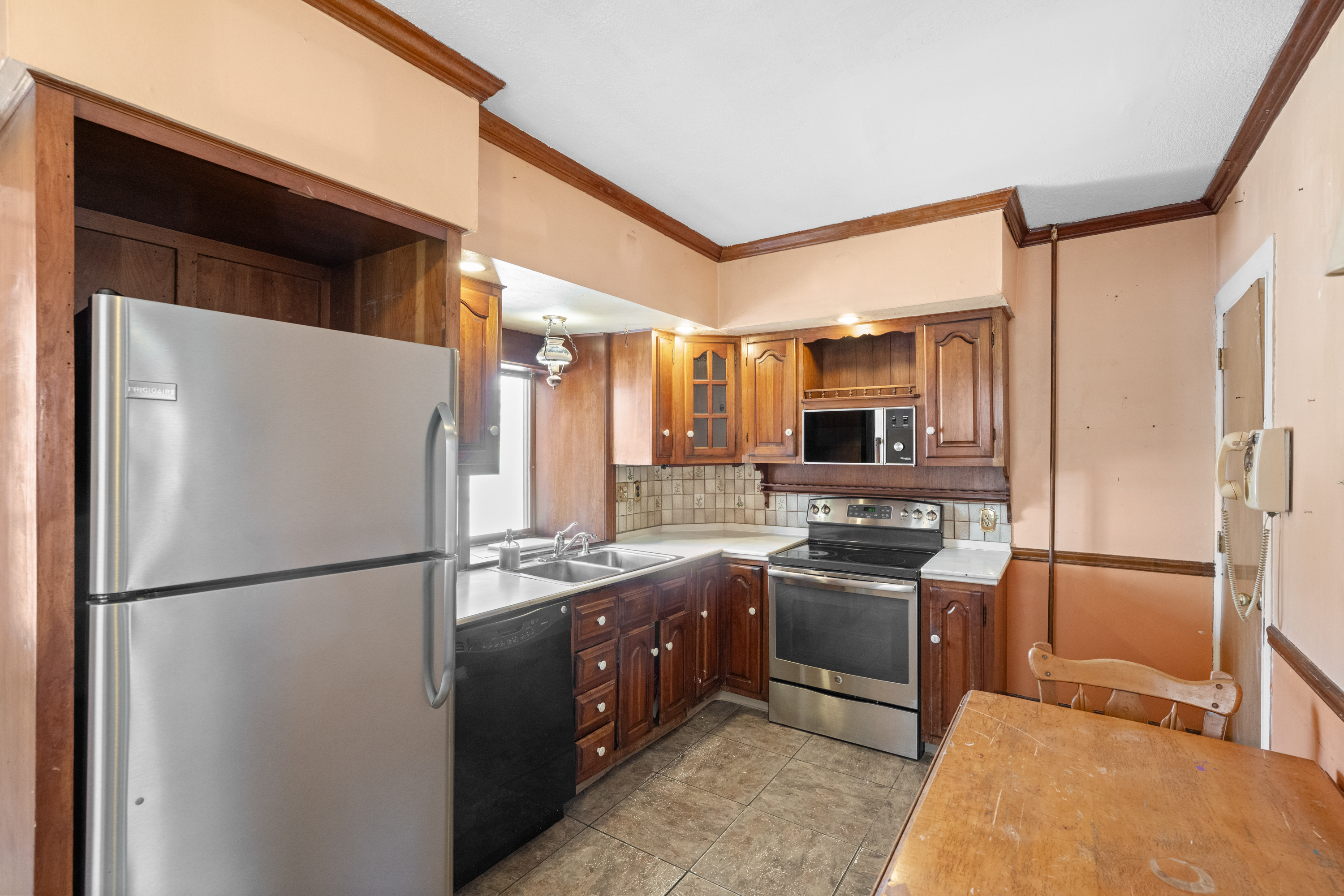 458 Renfrew Avenue Ambler, PA 19002 - Photo 19 of 32 a kitchen with stainless steel appliances granite countertop a refrigerator and a sink