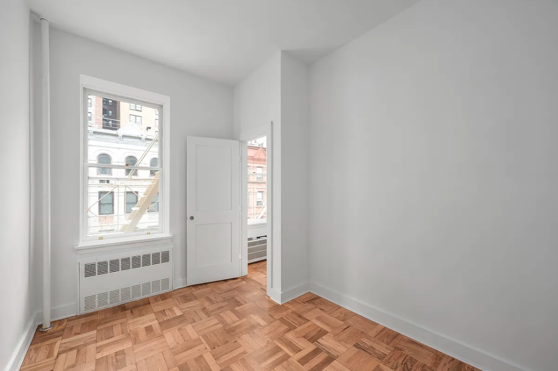 151 West 80th Street, Unit 4F Manhattan, NY 10024 - Photo 4 of 8 a view of an empty room with a window