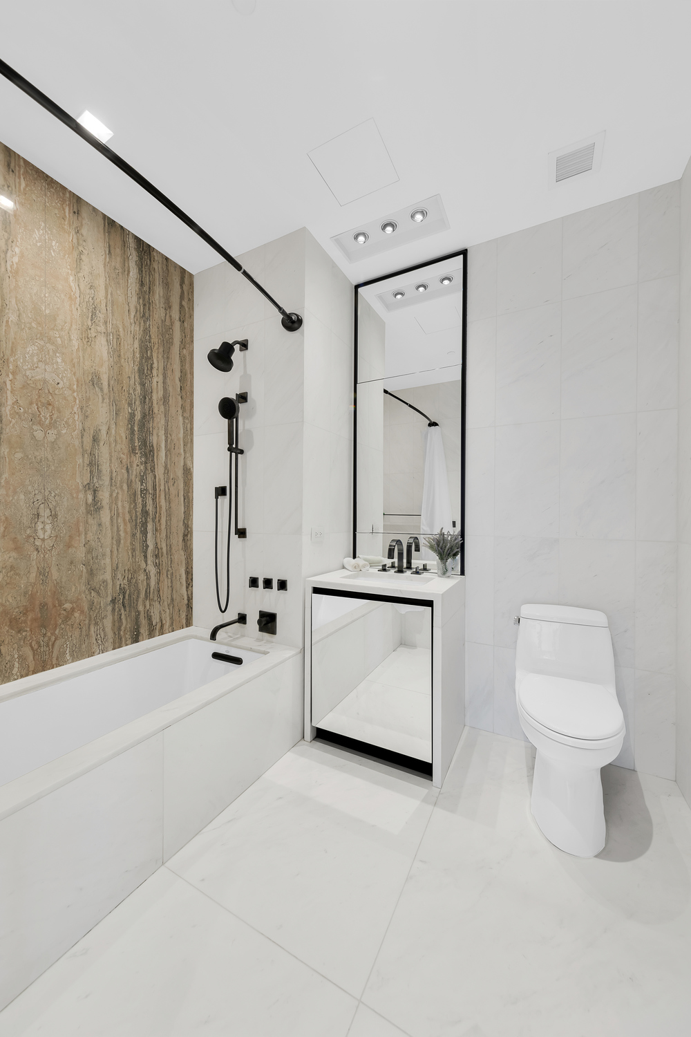 111 Murray Street, Unit 11C Manhattan, NY 10007 - Photo 7 of 14 a bathroom with a sink a toilet and a mirror