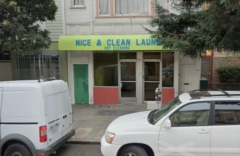 a front view of a house with parking space