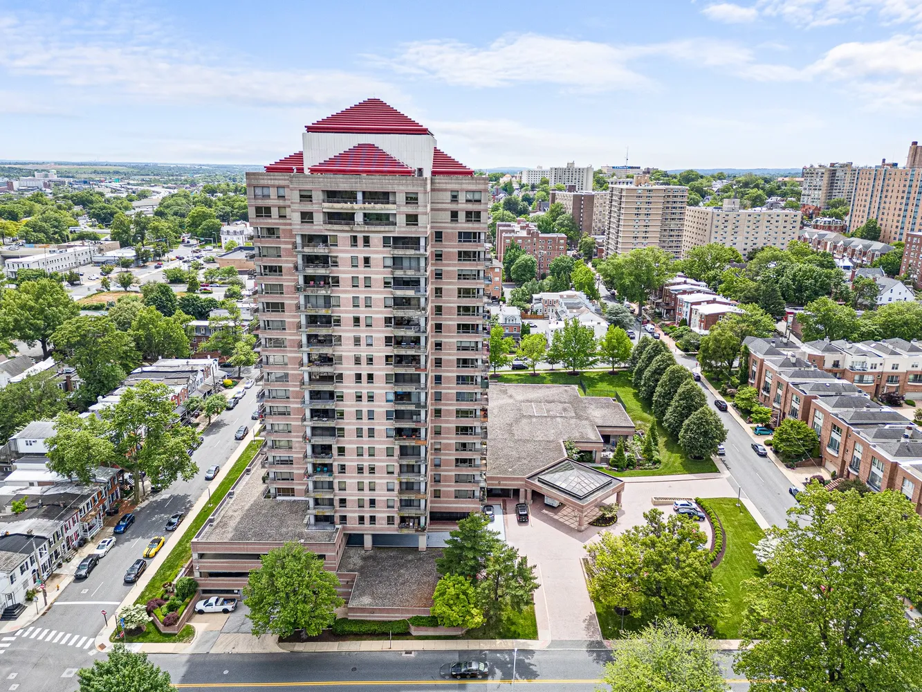 a kitchen with stainless steel appliances granite countertop a stove a sink dishwasher a refrigerator with wooden cabinets and floor