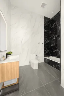 a bathroom with a bathtub and shower