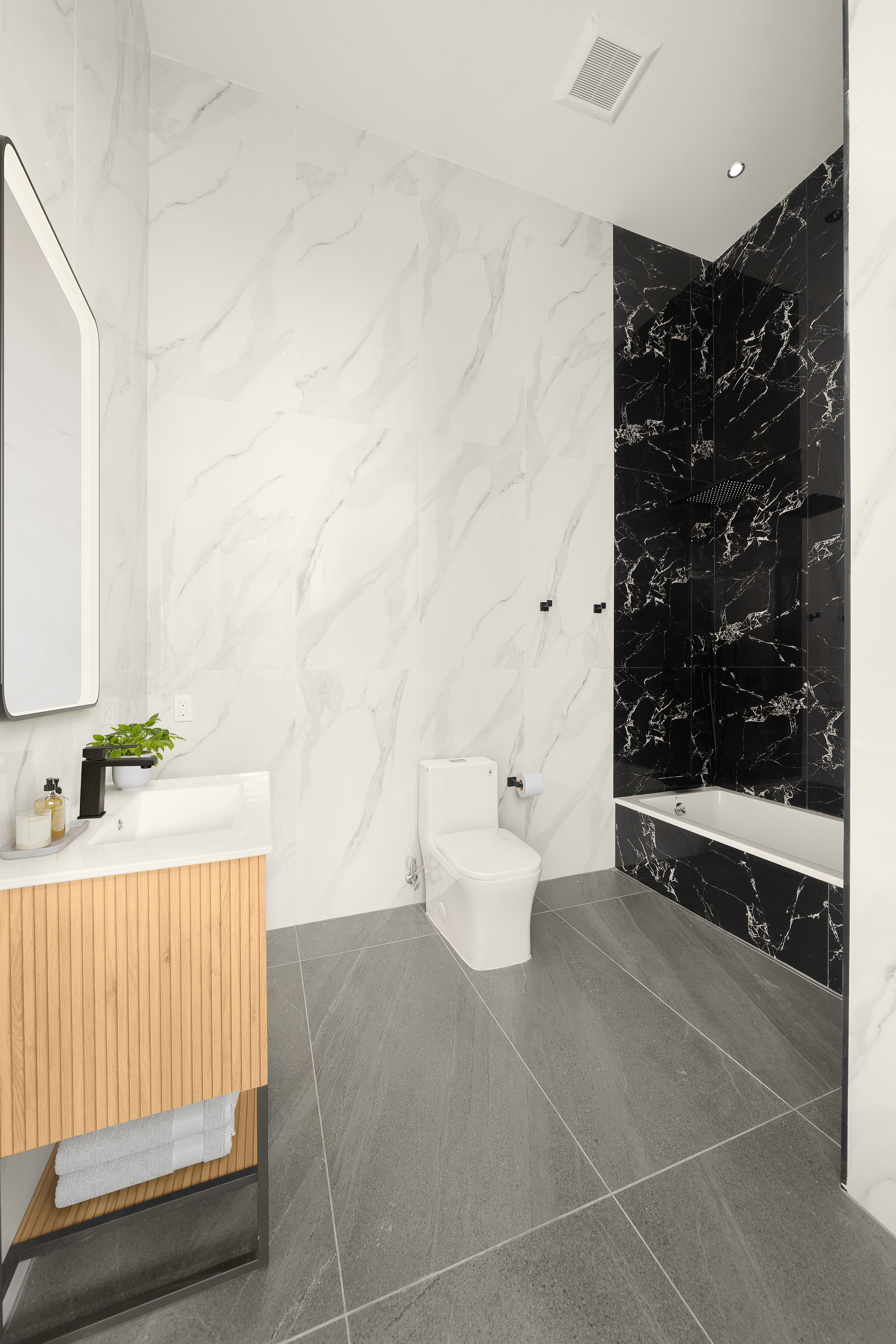 216 Grand Street, Unit LOFT 3 Brooklyn, NY 11211 - Photo 8 of 9 a bathroom with a bathtub and shower