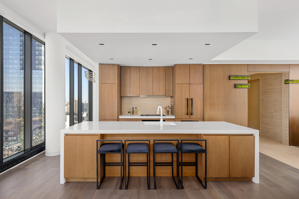 570 Broome Street, Unit PHB Manhattan, NY 10013 - Photo 4 of 23 a kitchen with a table chairs refrigerator and cabinets