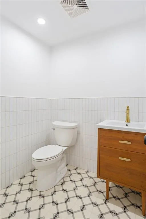 a bathroom with a toilet and a sink