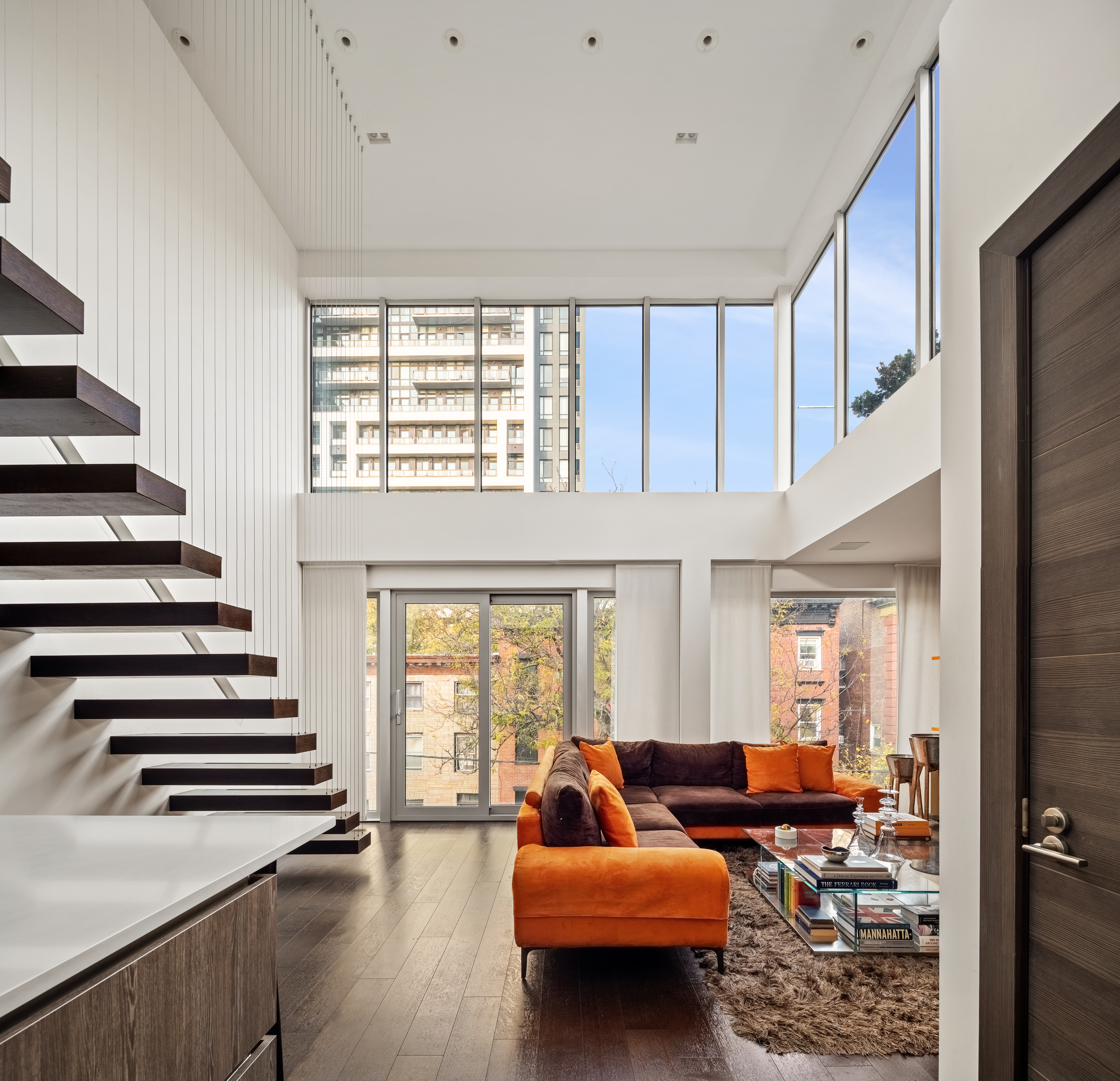 78 South 3rd Street, Unit 3 Brooklyn, NY 11249 - Photo 2 of 17 a living room with furniture and a large window