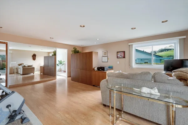a living room with furniture and a table