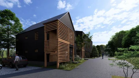 a backyard of a house with table and chairs under an umbrella