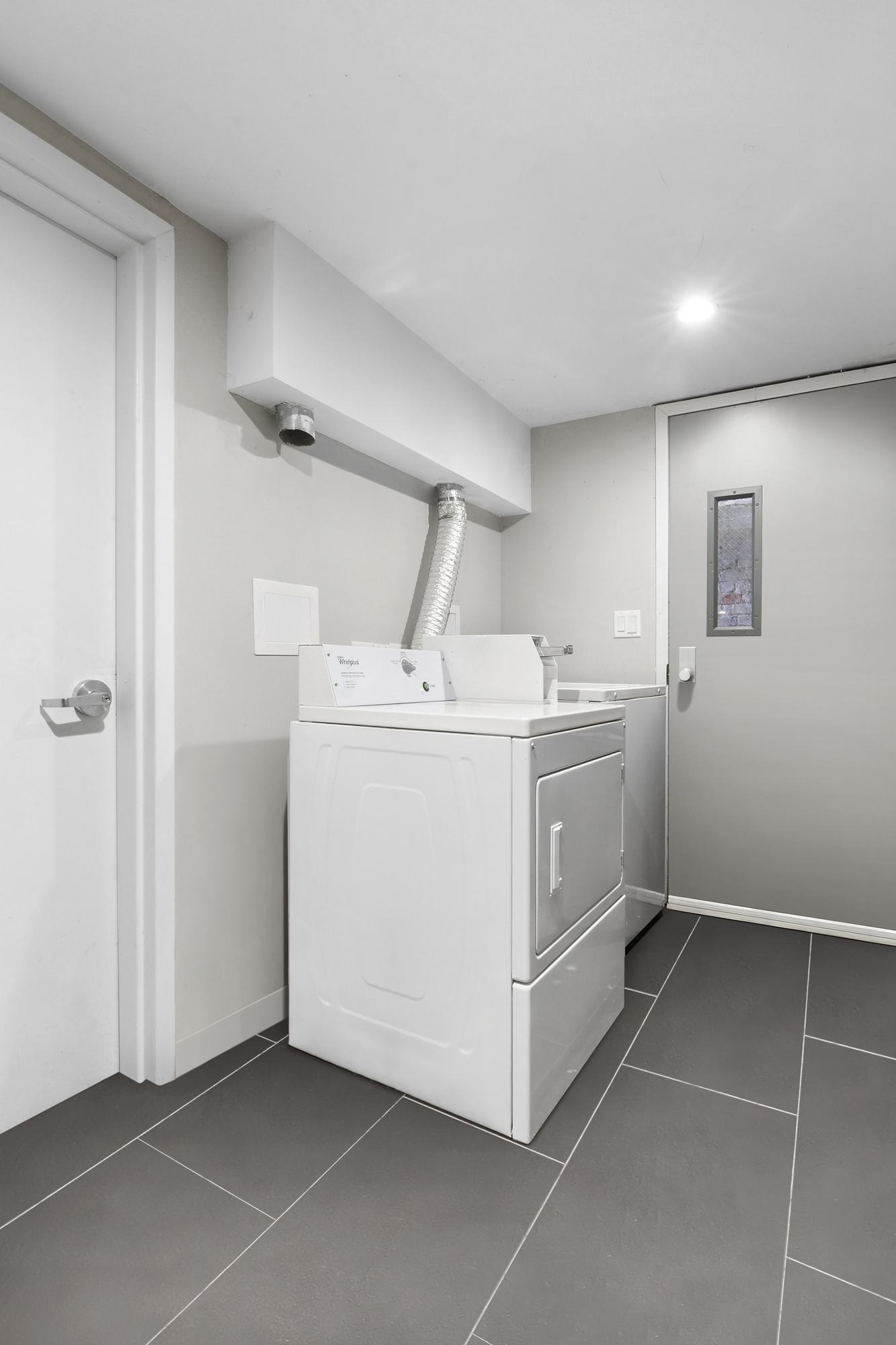 385 Chauncey Street, Unit 2R Brooklyn, NY 11233 - Photo 3 of 3 a utility room with cabinets washer and dryer