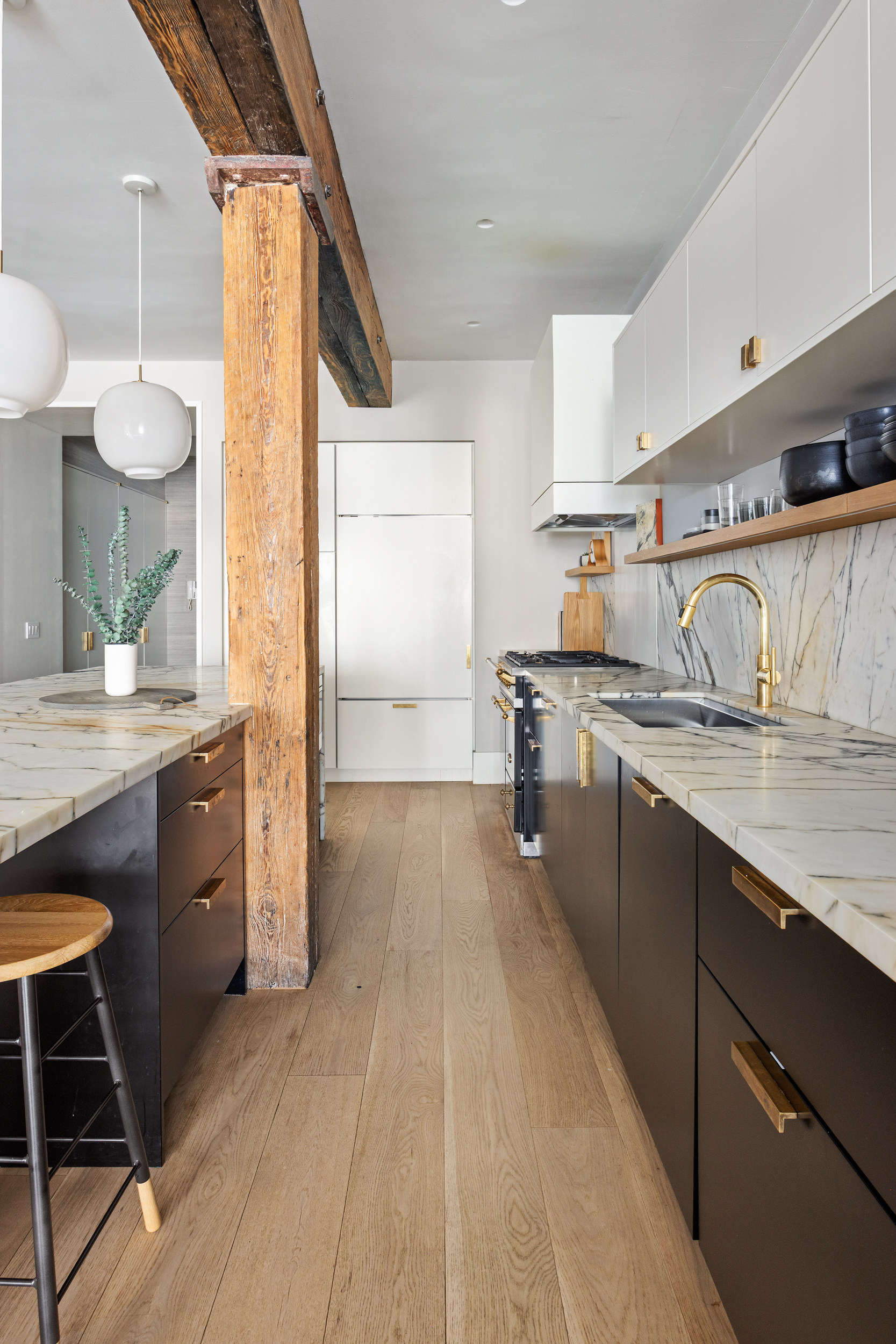 622 Greenwich Street, Unit 4B Manhattan, NY 10014 - Photo 12 of 27 a kitchen with granite countertop a sink stove and cabinets