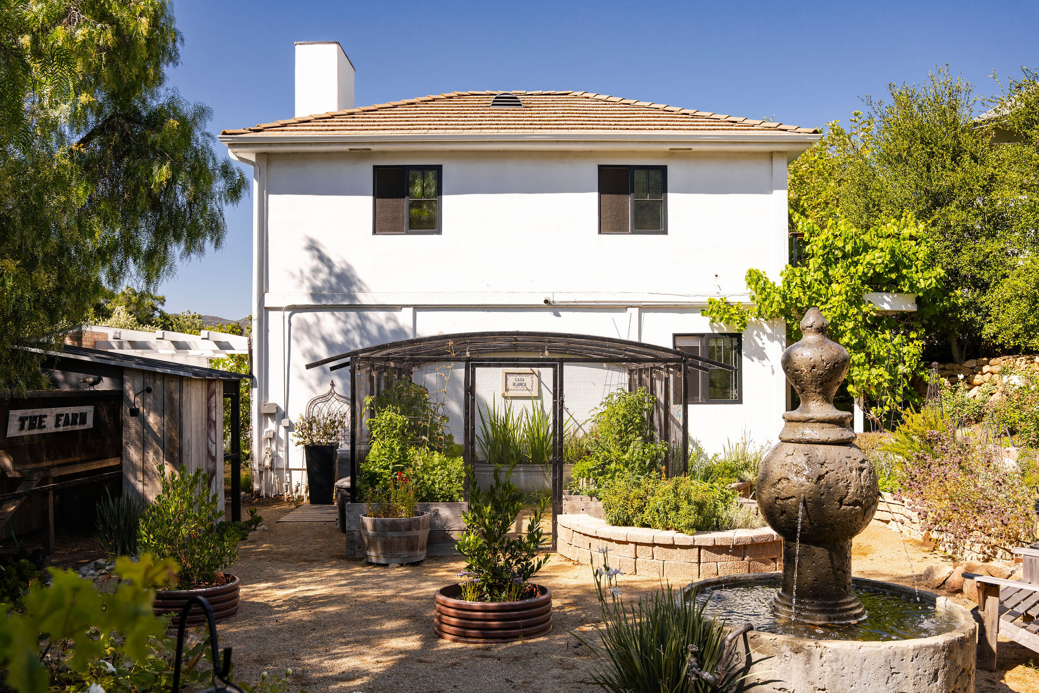 560 Cold Canyon Road Calabasas, CA 91302 - Photo 53 of 84 a front view of a house with garden