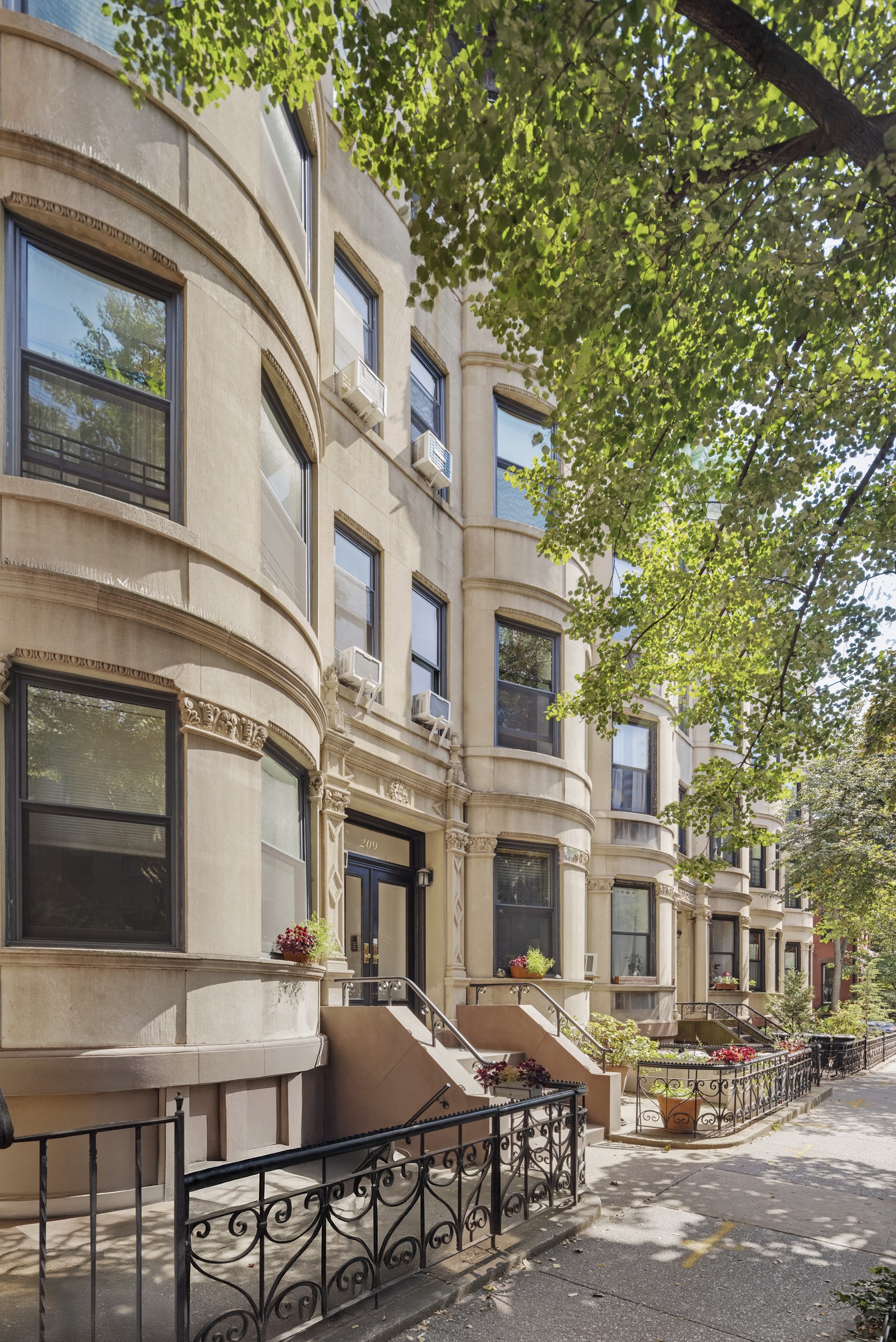 209 Clinton Street, Unit 4L Brooklyn, NY 11201 - Photo 16 of 17 a view of a building with a table and chairs