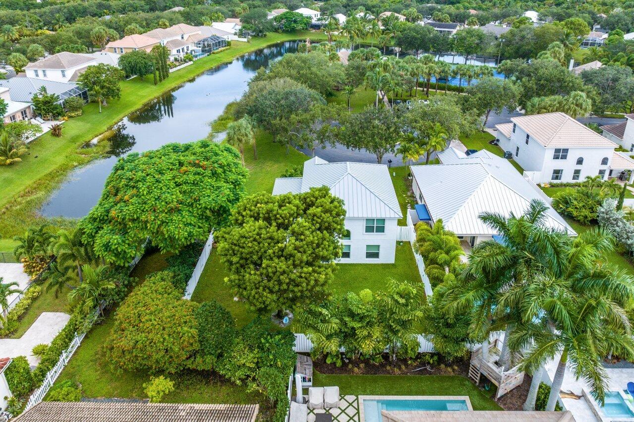 1182 Canoe Point Delray Beach, FL 33444 - Photo 37 of 46 an aerial view of a house with a yard and lake view