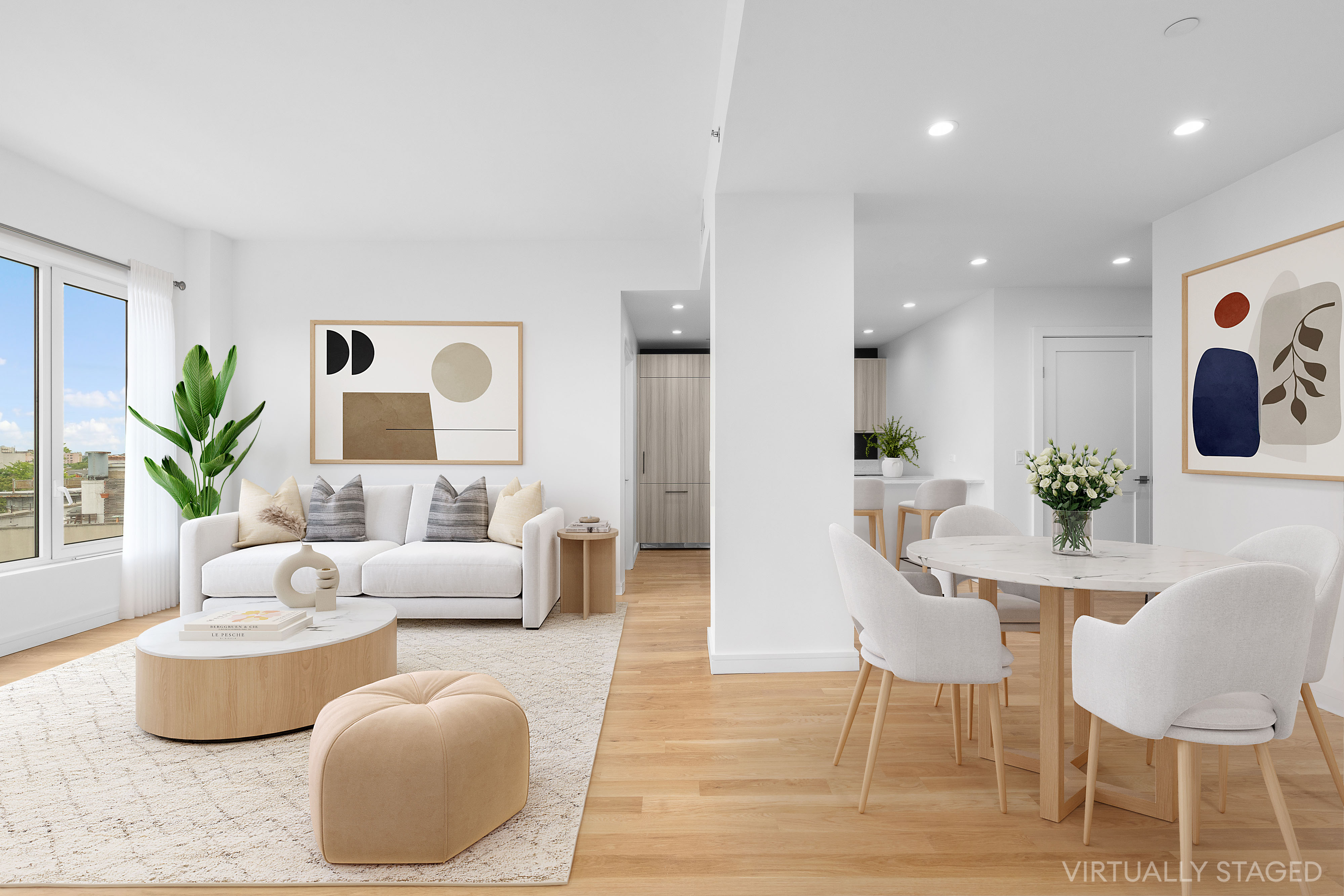 a living room with furniture and a potted plant