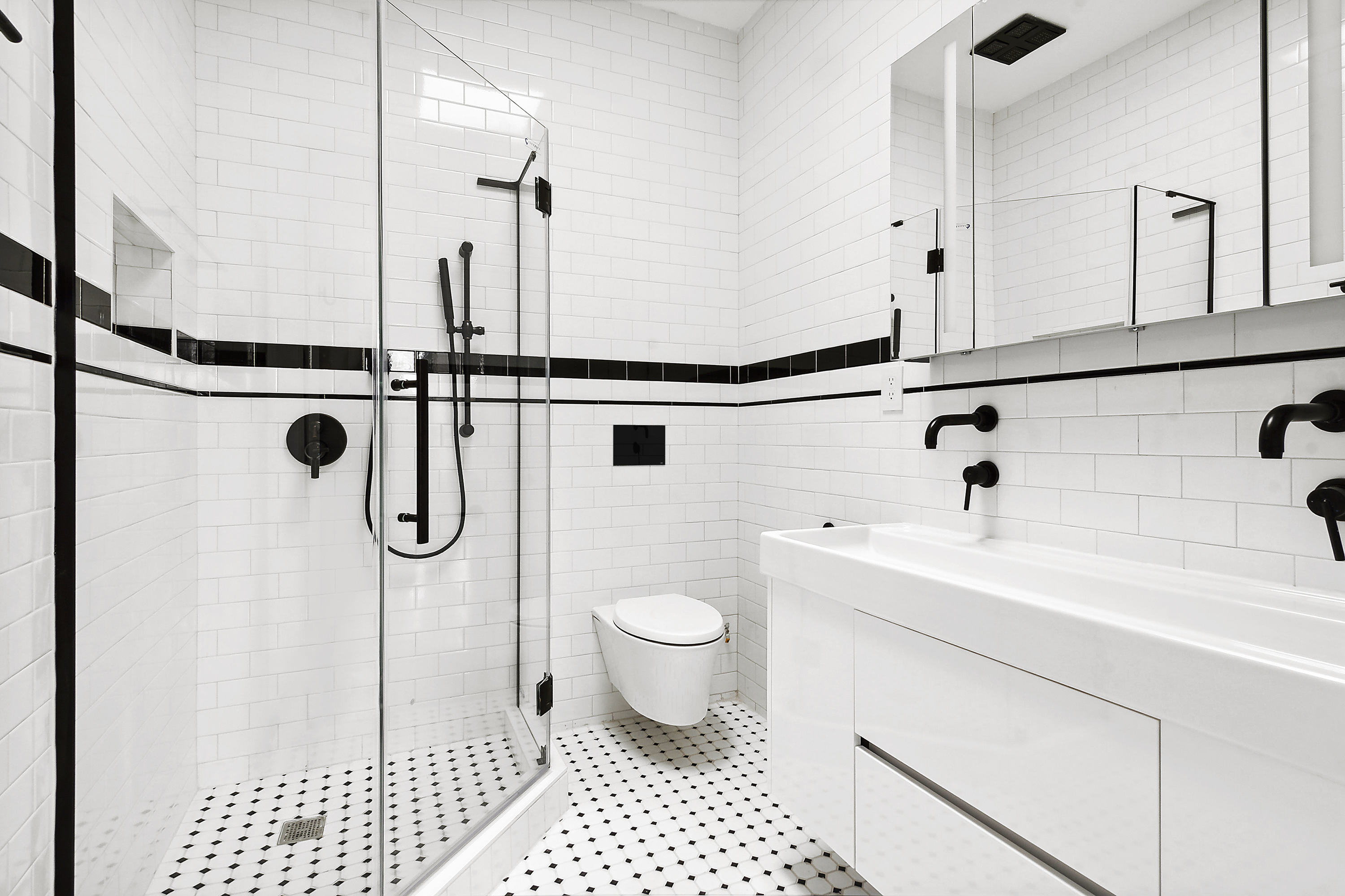 195 Rutland Road Brooklyn, NY 11225 - Photo 11 of 21 a bathroom with a sink a toilet a mirror and shower