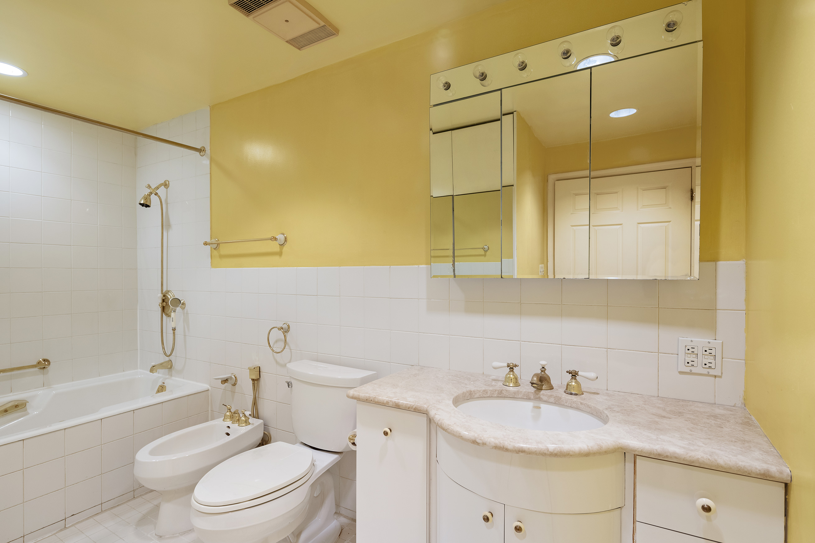 144 West 80th Street Manhattan, NY 10024 - Photo 20 of 22 a bathroom with a granite countertop sink toilet mirror vanity and bathtub